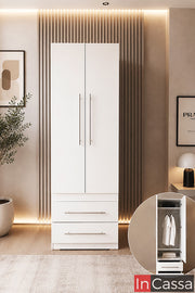 Se observa el Guardarropa Modelo EDIMBURGO en color blanco, un mueble de diseño contemporáneo que combina elegancia y funcionalidad para mantener la recámara perfectamente organizada. Cuenta con un amplio compartimento para colgar prendas largas, dos cajones inferiores de gran capacidad y puertas de apertura suave con jaladeras metálicas, ofreciendo una solución práctica para almacenar ropa, accesorios y artículos de uso diario sin ocupar demasiado espacio.