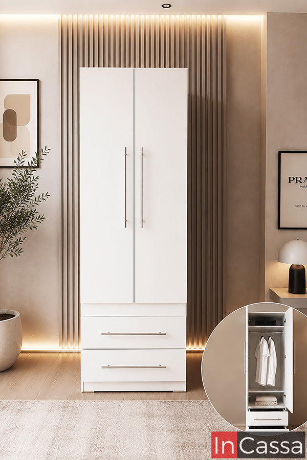 Se observa el Guardarropa Modelo EDIMBURGO en color blanco, un mueble de diseño contemporáneo que combina elegancia y funcionalidad para mantener la recámara perfectamente organizada. Cuenta con un amplio compartimento para colgar prendas largas, dos cajones inferiores de gran capacidad y puertas de apertura suave con jaladeras metálicas, ofreciendo una solución práctica para almacenar ropa, accesorios y artículos de uso diario sin ocupar demasiado espacio.