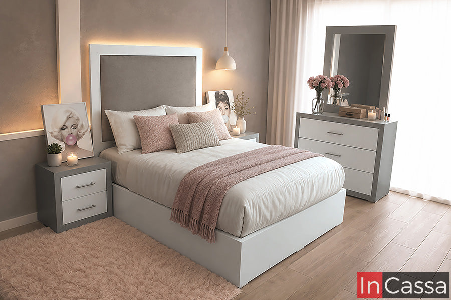 Recámara Modelo HONDURAS con cabecera tapizada y base blanca, combinada con buró de cajones y tocador con amplio espejo. Su acabado silver con frentes blancos crea un contraste moderno y luminoso, ideal para un dormitorio elegante, funcional y acogedor.