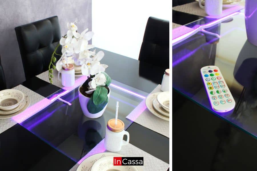 Esta foto muestra un acercamiento al sistema de iluminación LED de la mesa, controlado por un práctico mando a distancia. Este detalle no solo aporta un toque futurista, sino que también permite personalizar el ambiente según la ocasión.