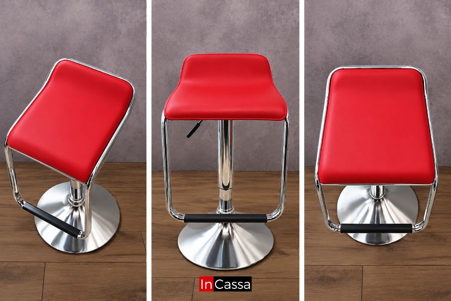 Bancos de la Cantina LUXOR con asiento rojo, estructura cromada, base circular, reposapiés y altura ajustable. Su diseño moderno y ergonómico complementa la barra y brinda comodidad con un estilo elegante y contemporáneo.