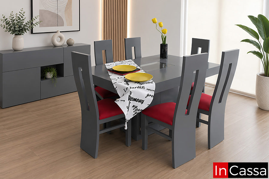 Se aprecia el Comedor Modelo MALTA para 6 personas en color gris medio con asientos tapizados en tacto piel rojo, un diseño contemporáneo que combina líneas rectas, acabados modernos y una elegante combinación de colores. Su amplia cubierta incorpora un detalle central de cristal que aporta un toque sofisticado, mientras que las sillas con respaldo alto y asientos tapizados brindan excelente comodidad, convirtiéndolo en una opción ideal para disfrutar reuniones familiares o con invitados.
