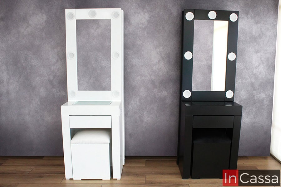 Se presenta la versión blanca y negra del Tocador Vanity Santorini, ambas con espejo iluminado y diseño minimalista. La imagen destaca la estructura limpia con bancos acolchados, ideal para espacios modernos y funcionales.